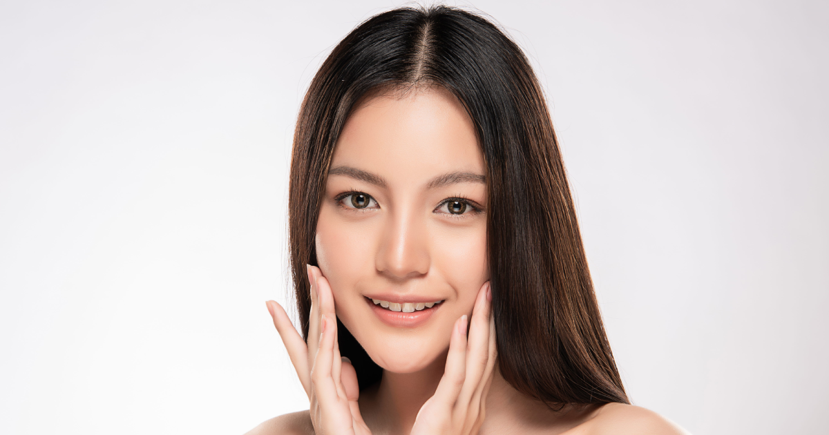 A radiant woman in New York, NY, showcases her healthy Skinvive glow