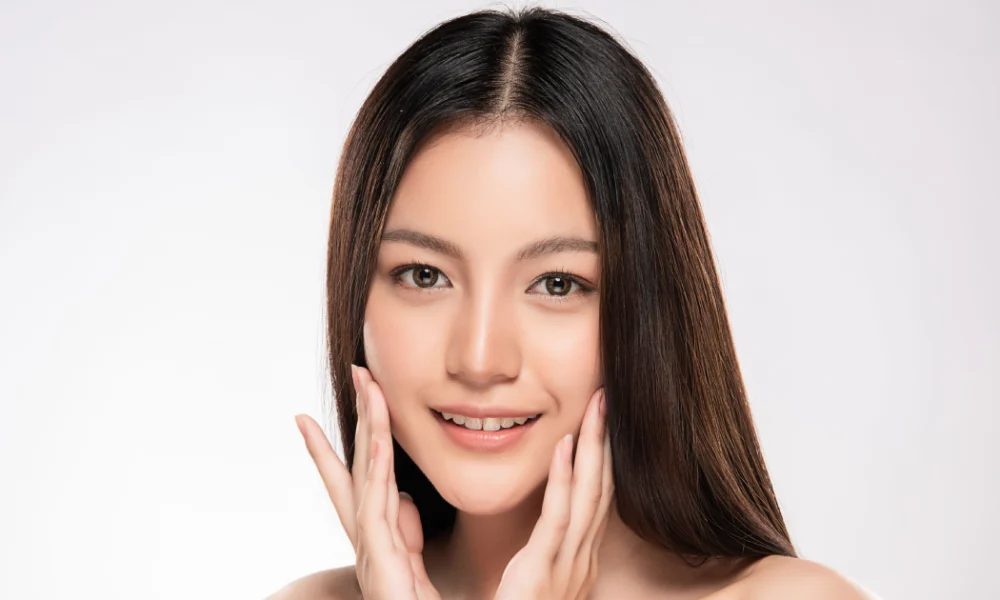 A radiant woman in New York, NY, showcases her healthy Skinvive glow